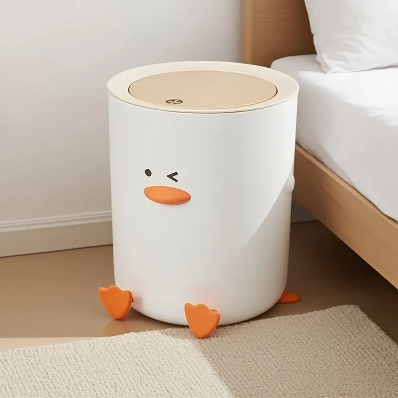 A charming trash can with a lid, in the shape of a cartoon duckling, perfect for a variety of places such as the kitchen, bathroom, living room or office. It is a stylish and hygienic wastebasket.