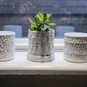 3D printed flower pots with skulls.