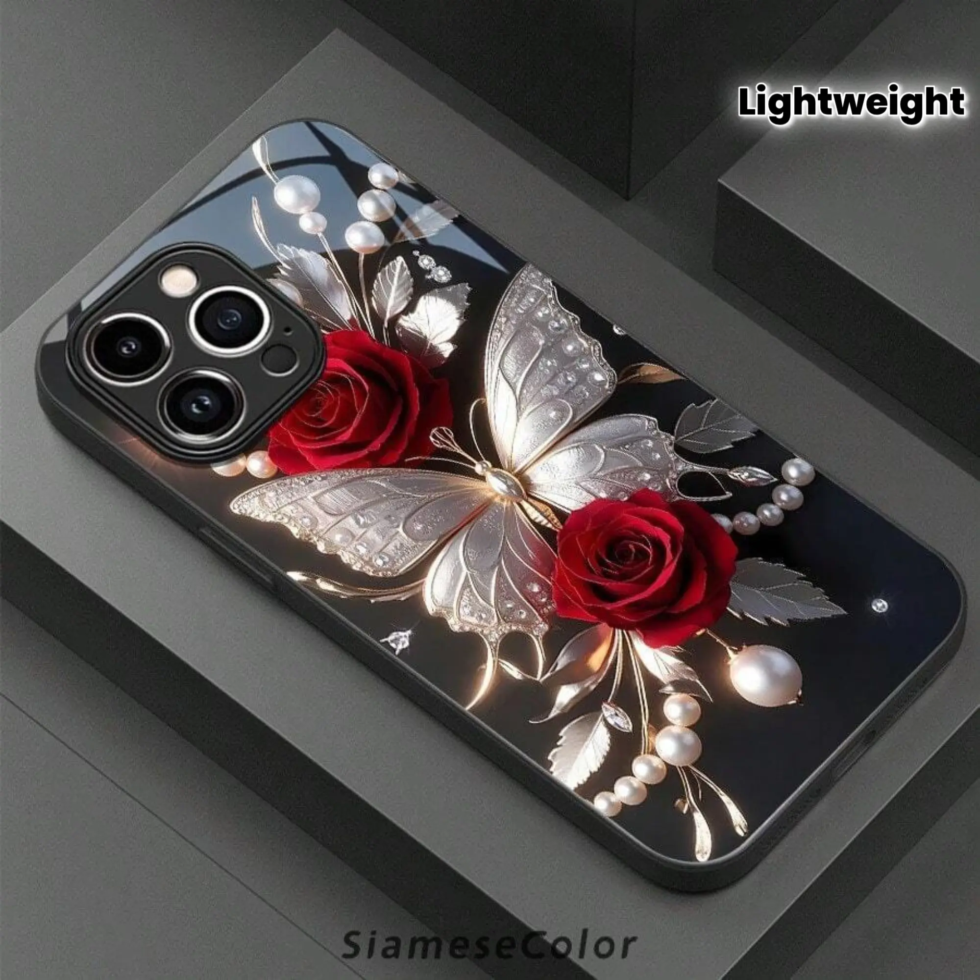 An elegant phone case with a butterfly design, featuring luxurious red rose jewelry, suitable for iPhone 16 Pro Max, 15, 14 Plus, 13, 12, and 11. Lightweight, non-slip, suitable for both men and women