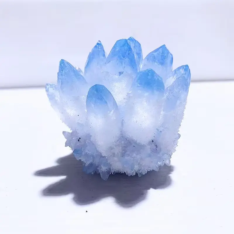 A natural high-quality blue crystal cluster flower with a random style and mineral specimen, suitable for decorating office desks, wine cabinets, aquariums, and collecting crystals. It is a holiday gift for crystal enthusiasts light up decor aesthetic