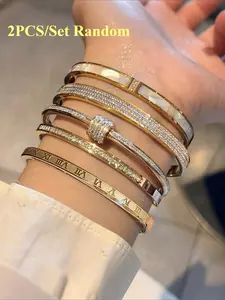 2pcs/set Random Stainless Steel Stackable Bracelets in a Non-Fading Golden Color, Adorned with Rhinestones, Unisex Fashionable Jewelry Suitable for All Occasions.