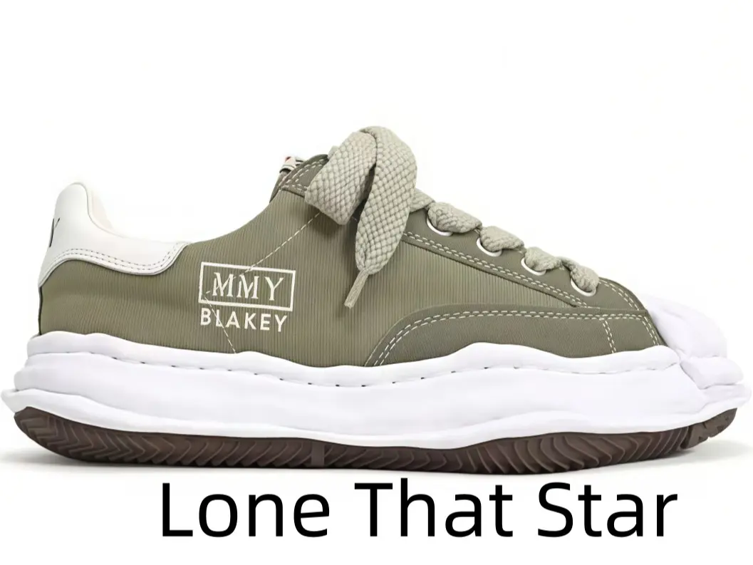 Vintage olive green shell-toe casual sneakers with sculpted wavy thick white midsole, wide beige fabric laces, white heel trim and textured brown rubber outsole, matching cargo pants, jeans and muted neutral streetwear fits