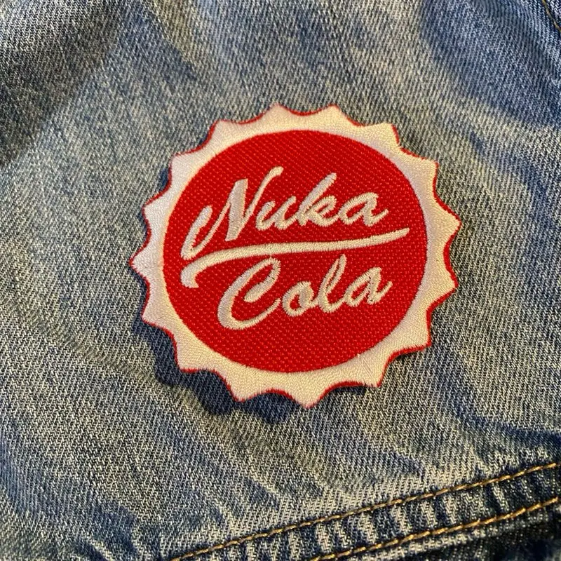 Fallout Nuka-Cola Logo Patch (1 Count), 2.88in Unique Embroidery Sewing Accessory, Durable Stitching, Sew-On-Iron-On-Hook Backing, High-Quality Fabric Trim for Fallout Enthusiasts’ Cosplay Costumes & Custom DIY Projects, Retro Flair for Jackets, Bags, Gam