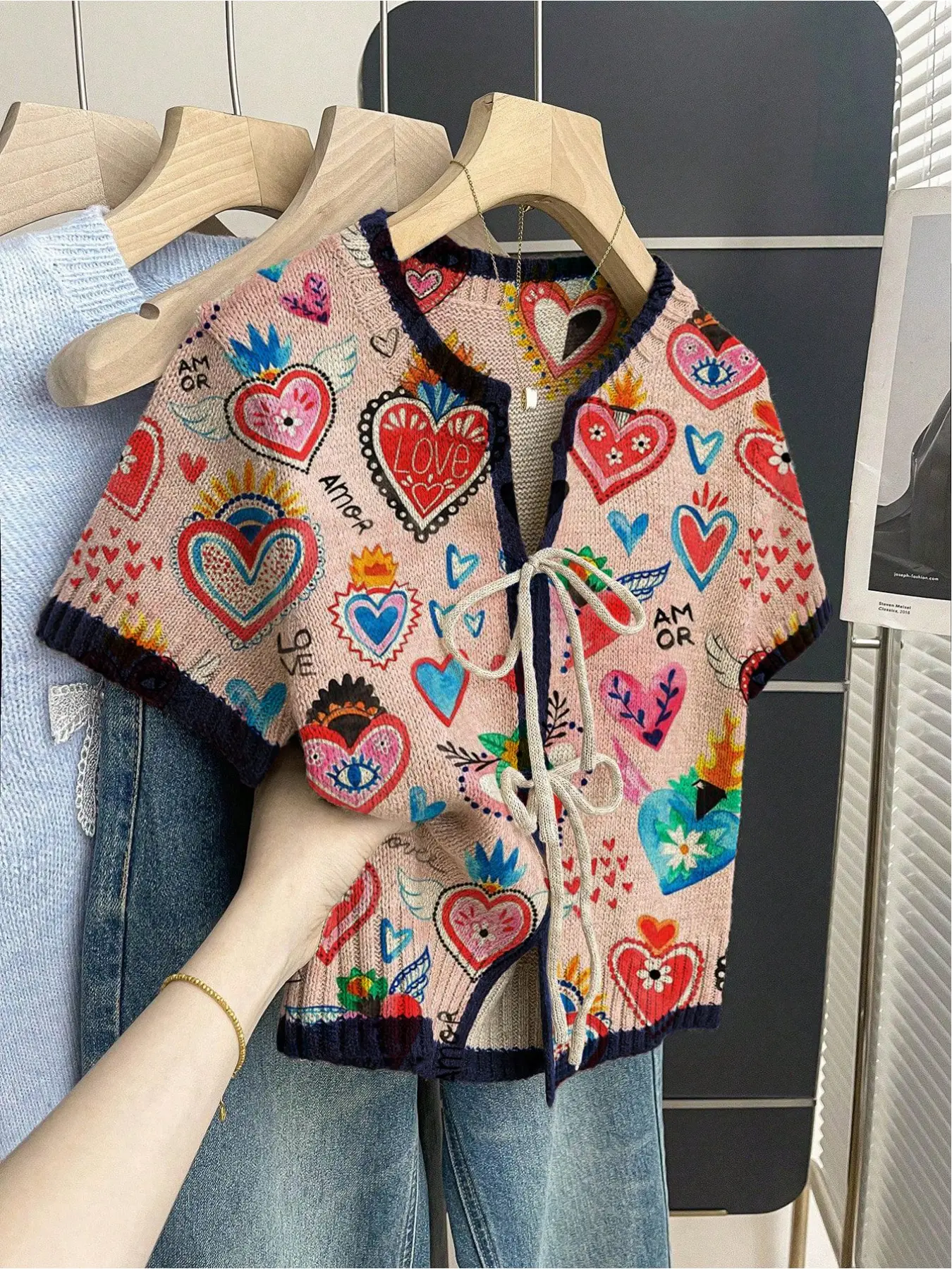 Women's khaki bohemian vacation short-sleeve knit top. Loose round neck, contrast heart print, front tie and contrast piping. Perfect for spring, summer and Valentine's Day Casual Cute wear.