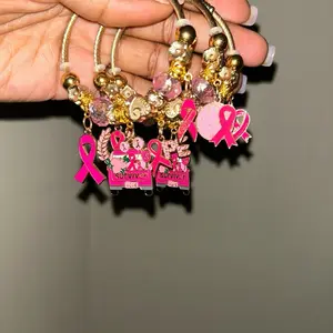 Pink Breast Cancer Charm Bracelet with Pink Ribbon Charms and Survivor Tags for Support and Awareness