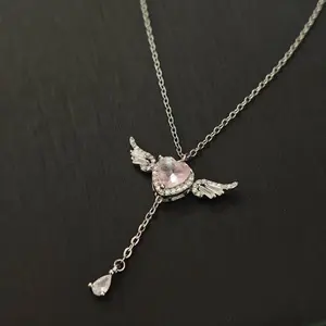 Collarbone chain with pink heart-shaped zircon tassel — Cupid’s Heart necklace for women; light luxury, niche, high-end, angel wings