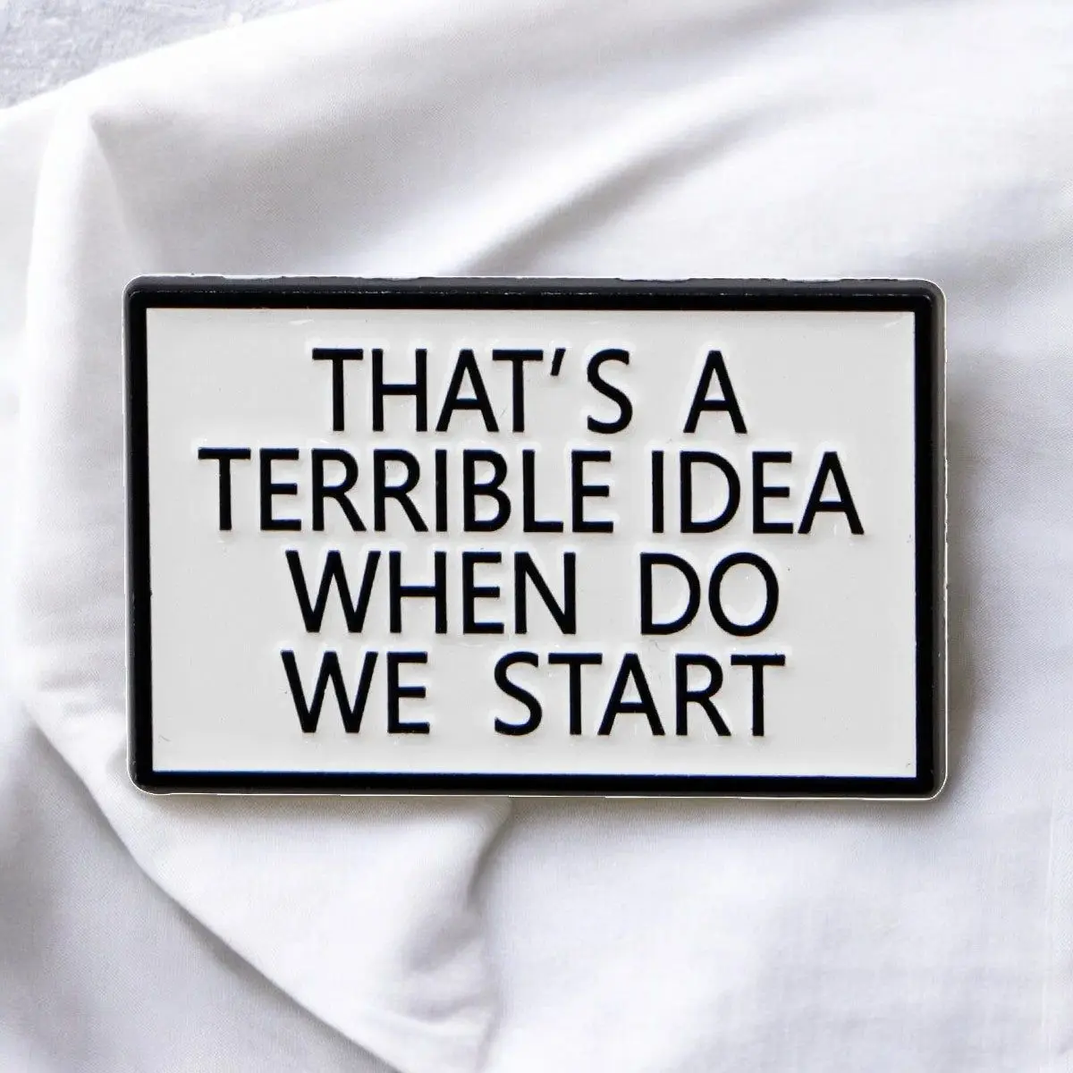 That’s a Terrible Idea Funny Enamel Pin – Sarcastic Black and White Badge for Chaos Lovers, Coworkers & Besties