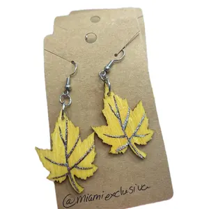 Wooden maple leaf earrings.