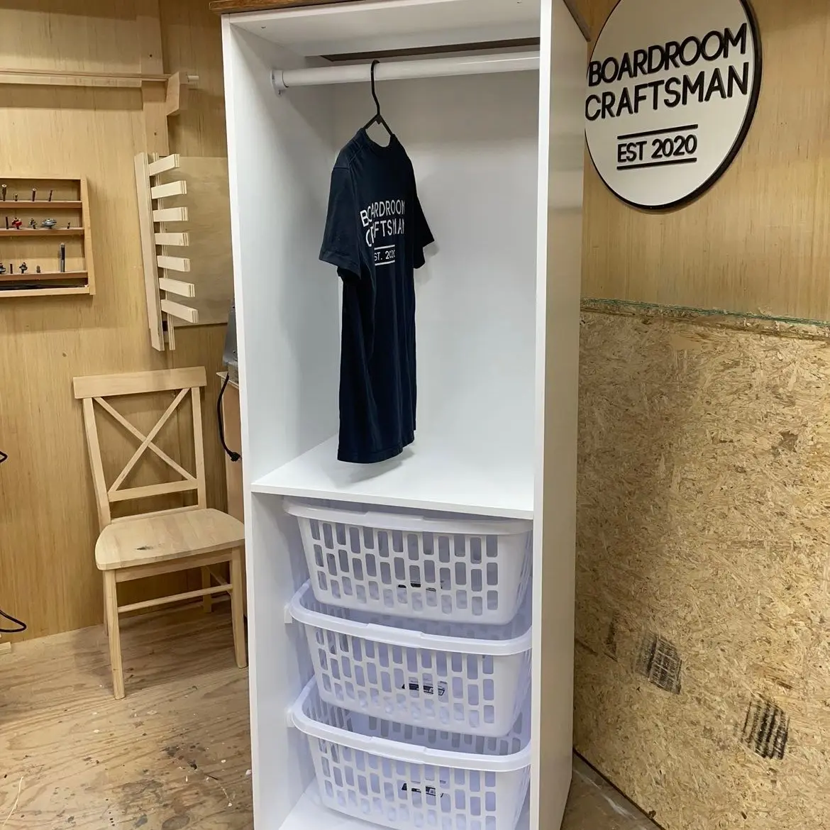 3 tier laundry basket organizer, with clothes hanger above   About 5’ tall, 20” wide and 24” deep