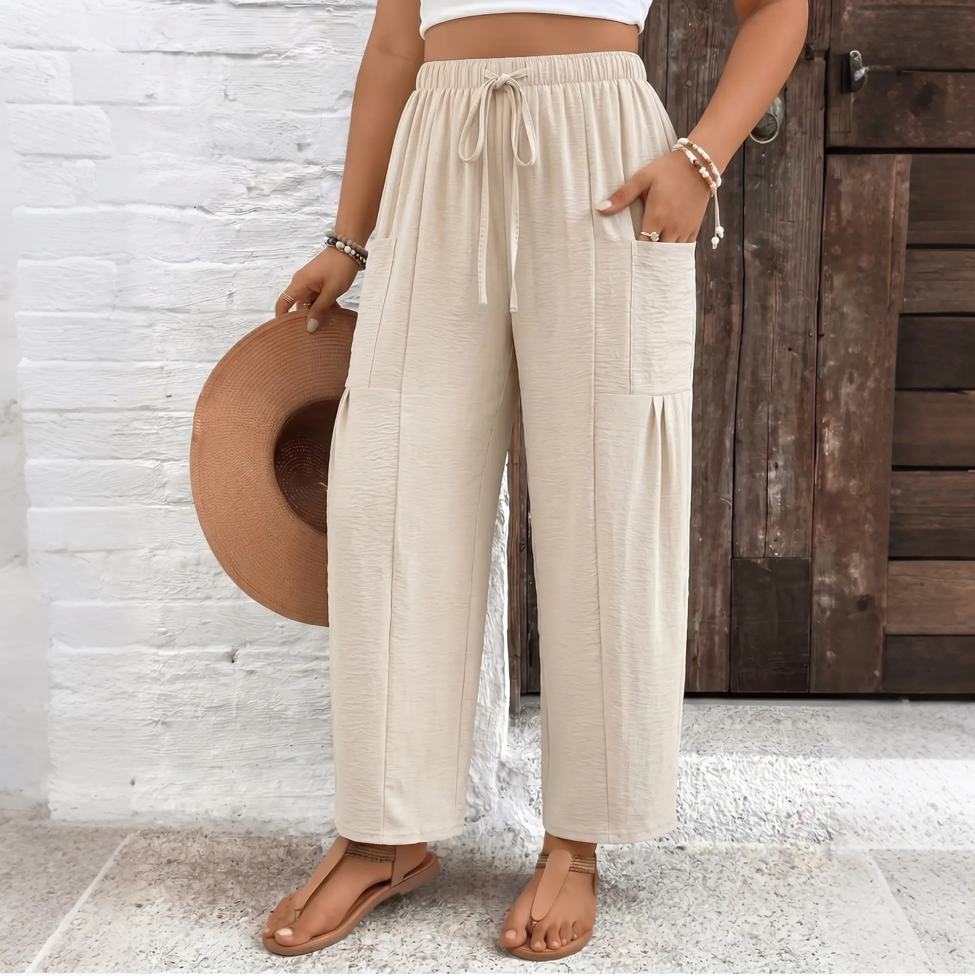Women’s casual wide-leg nine-tenths pants with an elastic drawstring waist, wrinkle-resistant textured fabric, and pockets—versatile for business-casual wear, suitable for office, home office, brunch dates, and everyday outfits.