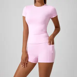 two-piece athletic set consisting of a solid round-neck T-shirt and high-waist tight sports shorts.yoga, workouts at the women's gym