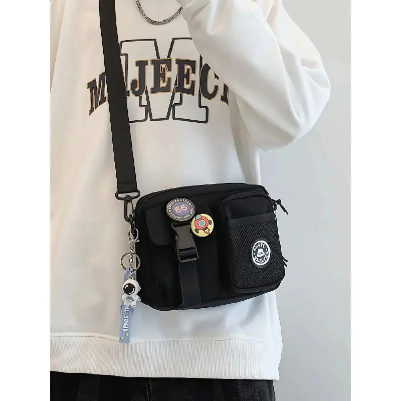 Unisex Casual Plain Color Release Buckle Crossbody Bag with Astronaut Charm, Fashionable Versatile Zipper Crossbody Bag with Random Color Badge, Trendy Shoulder Bag for Daily Use, Casual Messenger Bags, Stylish Crossbody Bags