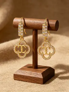 Stylish hollowed-out four-leaf clover flower earrings. Unique hollowed-out four-leaf flower design. Luxury earrings with 18k gold-plated copper, sparkling diamonds, and cubic zirconia