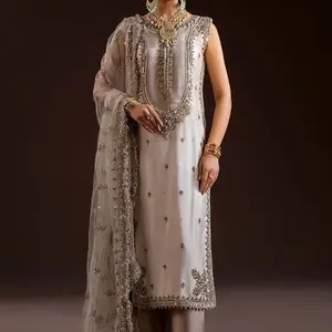 READY TO WEAR    What's Included: Shirt Sleeves Attached Inner Trousers (Elasticized waistband) Dupatta Fabric Details: Shirt: Pure glass silk (kora dabka zardozi work) Sleeves: Same as Shirt  Dupatta: Net Trousers: Pure Chermeuse Silk Disclaimer:  Produc