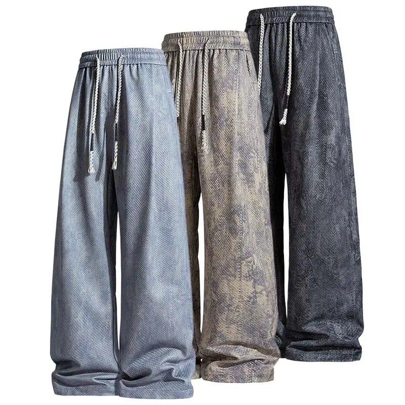 Japanese retro distressed textured casual pants—loose, relaxed wide-leg straight-cut joggers with a drawstring elastic waistband; comfortable, versatile, drapey athletic sweatpants suitable for teenage students.