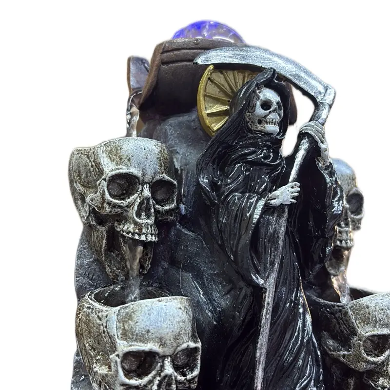 Santa muerte negra. Fuente de electricidad, 12 pulgadas de altura.