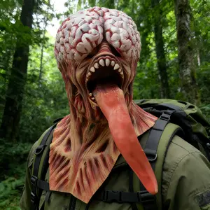 New bizarre horror mutant monster latex mask featuring an extremely terrifying swollen monster face, extra-long red tongue drooping downward, black vein carvings; a Halloween escape room prank prop and horror party role-play piece; one size fits most adul