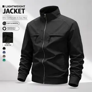 Men’s solid-color stand-collar zip-up jacket made from wrinkle-resistant, wear-resistant fabric; lightweight and windproof with a multi-pocket design and ribbed hem; suitable for office commuting and casual outings; fashionable casual outerwear.