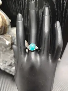 Ruby(11566)gc.Glacial Flame Ring - Icy Blue Oval Stone with Silver Claw Setting & Pavé Accents