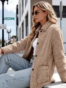 A women's light khaki lapel single-breasted loose faux shearling coat, made of soft and warm fabric, featuring a relaxed and casual fit. Perfect for everyday commuting, street outings, coffee dates, and other casual occasions in autumn and winter that bal