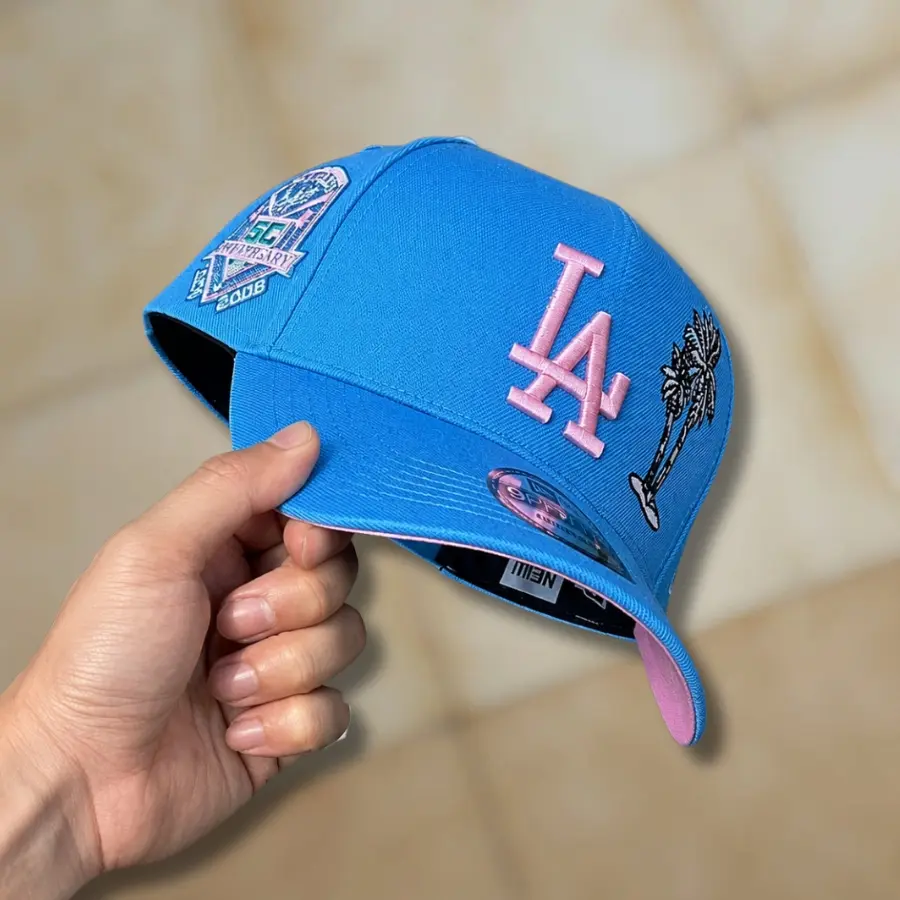 New Era Los Angeles Dodgers 9FIFTY Snapback Hat – MLB LA Dodgers 50th Anniversary Baseball Cap, Palm Tree Side Patch, Embroidered Pink Logo, Flat Brim, Limited Edition Unisex Streetwear Cap