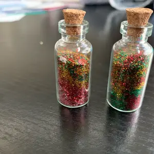 Miniature glass glitter bottle