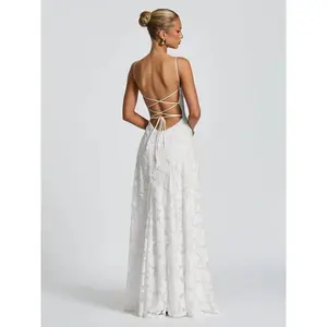 Elegant women’s white backless jacquard lace suspender maxi dress with thin shoulder straps and a back strap design, suitable for wedding parties, island vacations, and dinner dates