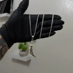 Conjunto Suerte Colmillo Coyote con cadena Cubana 3mm x 24 pulgadas. Ambos Plata 925