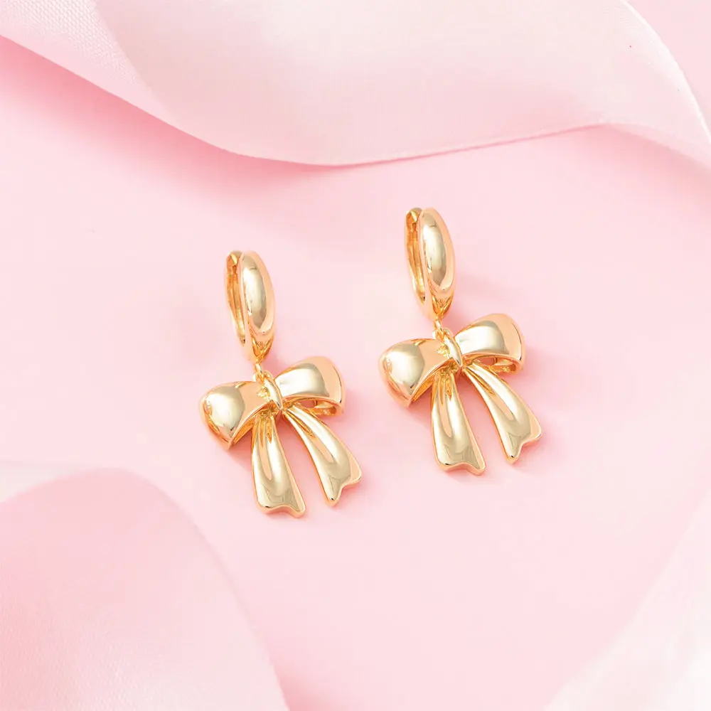Bow Huggie Hoop Earrings | Gold