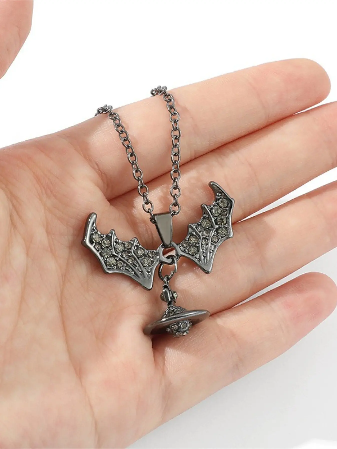 Hot-selling European and American new style personalized trendy diamond-encrusted bat wing planet skull pendant chain necklace for men and women alloy