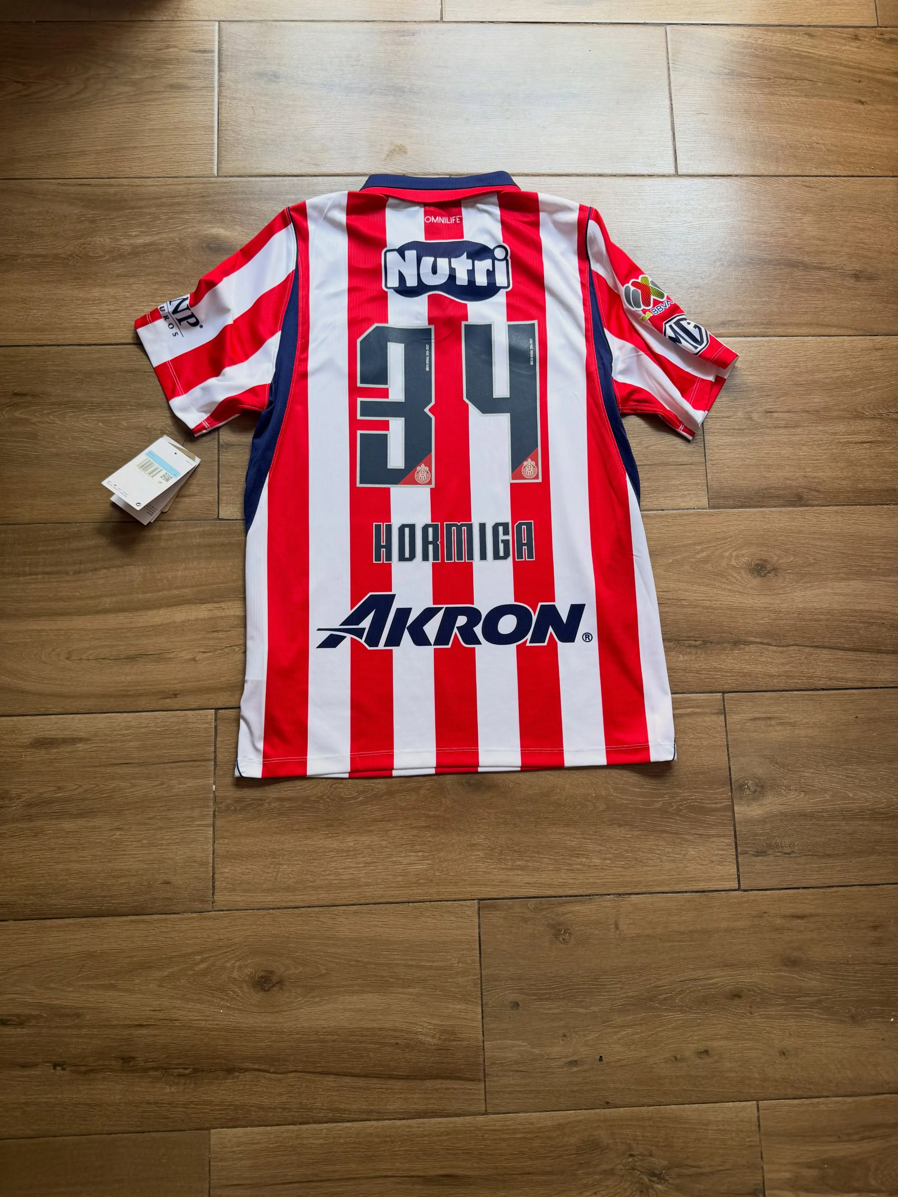 Hormiga and Alvarado Chivas 26-27 home jersey with full logos for fans.
