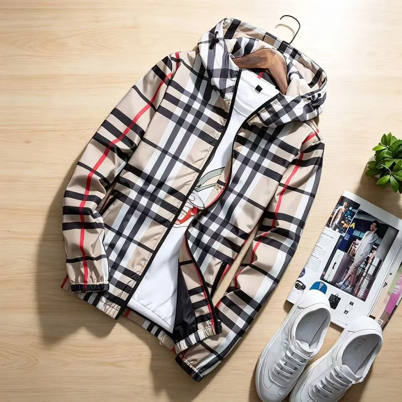 Men’s spring/autumn fashion jacket—lightweight hooded outerwear available with a stand collar; zip-up cardigan style windbreaker featuring adjustable drawstrings and contrasting stripe design; men’s outerwear in khaki plaid pattern.