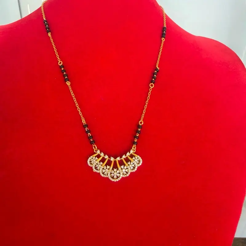 Gold plated daily use Nepali  Mangalsutra with black potey and multiple stone work on it.