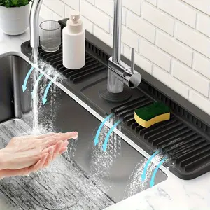 The kitchen sink comes with a foldable anti-splash pad featuring a 7° inclined design | Quick-drain faucet rear pad, fixed with snap fasteners | Water-resistant splash collection pad suitable for kitchen and bathroom countertops | Reusable, heat-resi