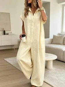 A lady's fashion French lazy-fit jumpsuit with a loose button-up design, featuring slimming wide-leg style, Womenswear Casual. Perfect for summer, suitable for light social occasions, afternoon tea, vacation trips, commuting, and at-home wear.