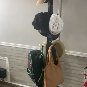 Freestanding Carbon Steel Garment Rack - Hall Tree with 12 Hooks, Sturdy Triangular Base, Compact Spacious Space Saver Entryway Stand with Display Stand Bag Hangers, Quick Setup Steel Pipes, Included Hat Organizer for Dorm, Hallway, Bedroom Home Furniture
