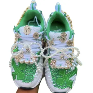 Green and white custom junk shoes with charms , patches,chains ,pearls and rhinestones