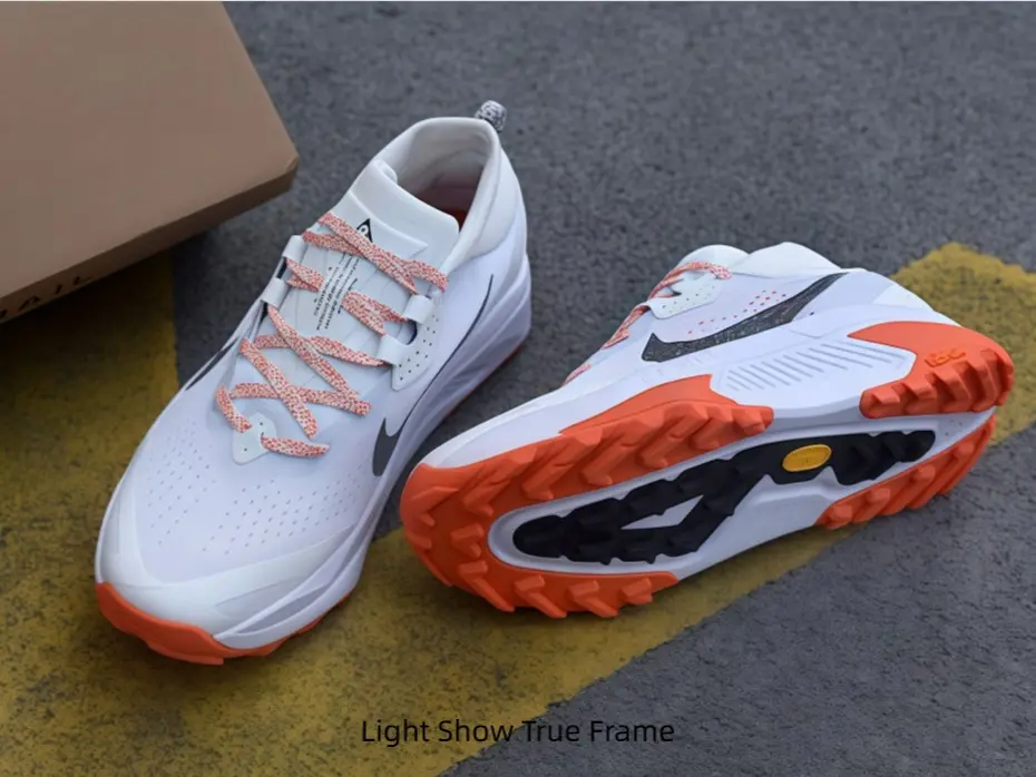 Stain-repellent white mesh uppers of these athletic shoes handle light salt splashes on shoreline strolls, warm orange tread tones complement linen shorts and flowy casual vacation wardrobe staples seamlessly.