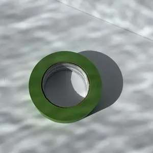 A green roll of tape to tape things up on a wall