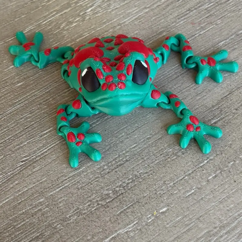 3D Printed Articulated Frog Toy with Green Body and Red Spots for Kids' Play