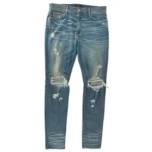 989933 Amiri Ripped Denim Blue
