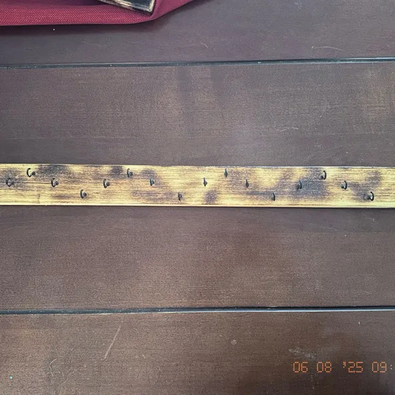 Handcrafted, burnt wood necklace holder (storage). Comes with anchors to secure it to the wall.