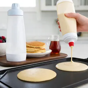 Hand-crank pancake batter dispenser, baking tool and kitchen accessory suitable for paper cup cakes, pancakes, and muffins; cooking utensil ideal for family gatherings.