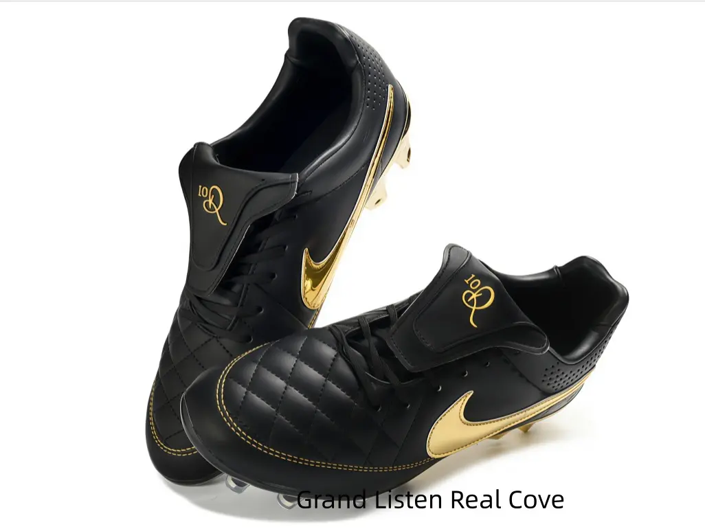 Sleek black quilted leather soccer cleats with shiny metallic gold embroidery accents