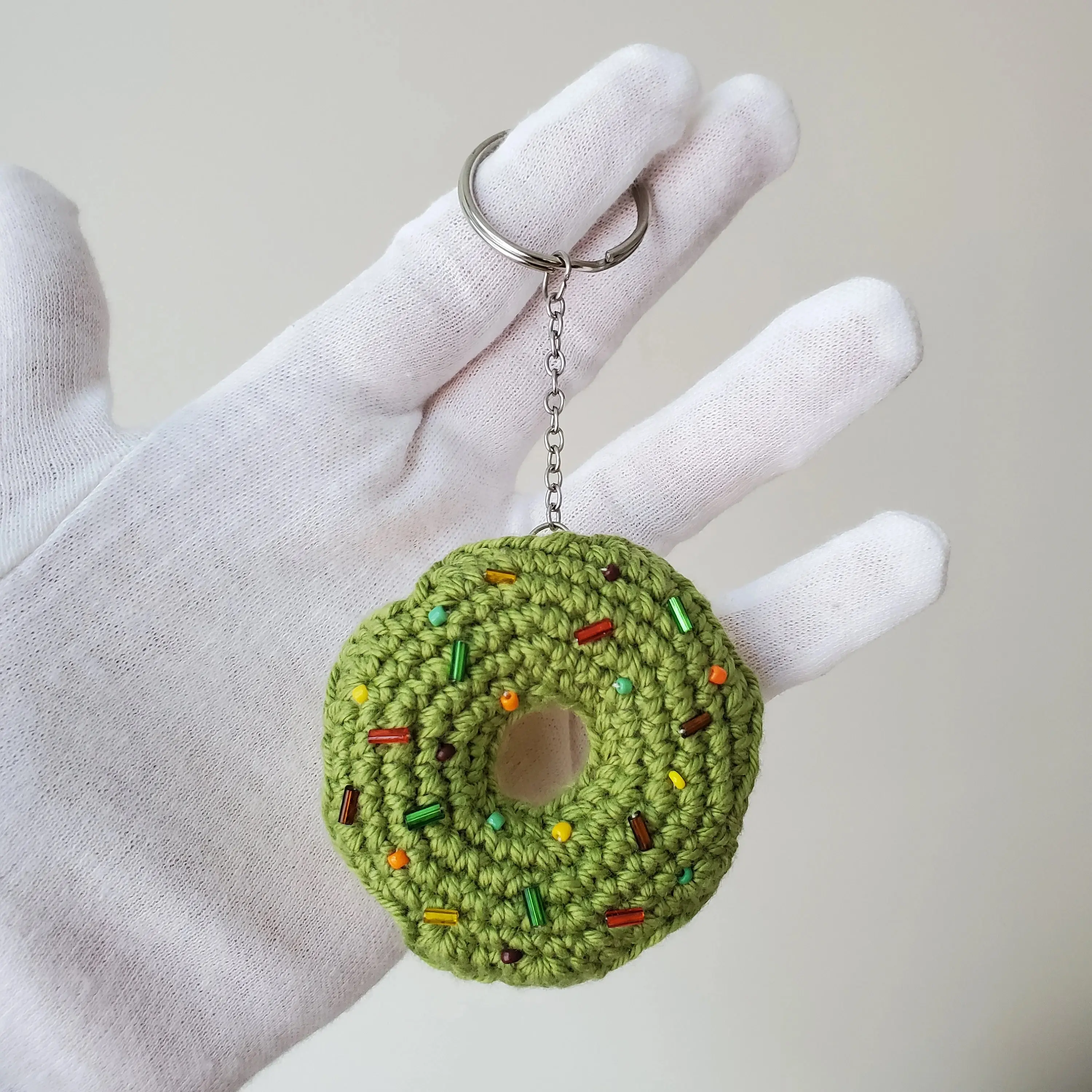 Hand crafted crochet pistachio-vanilla donut keychain