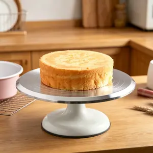 Aluminum alloy rotating cake turntable with graduated markings, smooth 360 Degree rotation, non-slip base, suitable for cake decorating and home baking.
