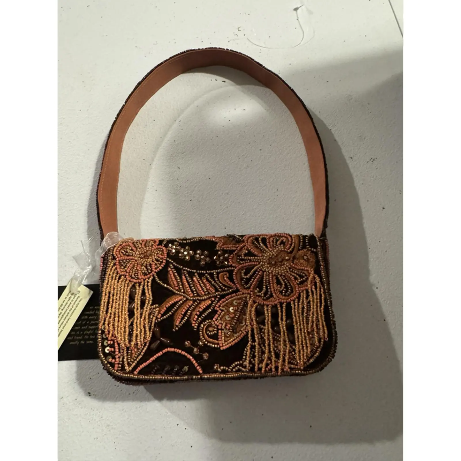 Elegant Floral Beaded Handbag with Fringe Detailing and Brown Leather Strap