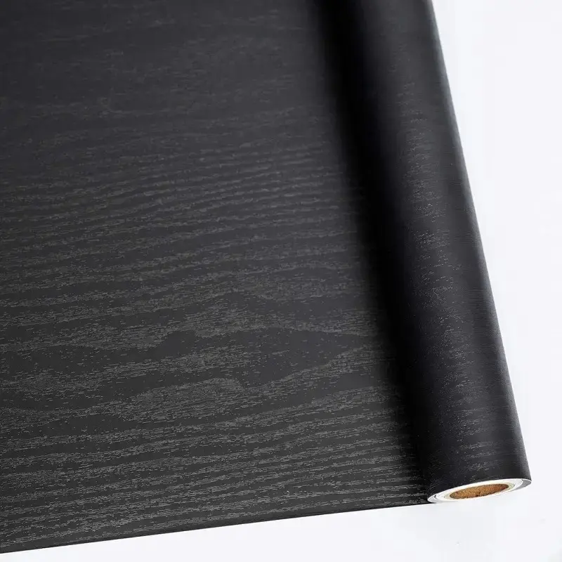 A roll of black wood grain stickers, Self Adhesive Wallpaper, waterproof and oil-proof vinyl film, suitable for kitchen, bathroom, furniture renovation, easy to paste and remove, hollow pattern, semi-gloss, self-adhesive, reusable PVC material