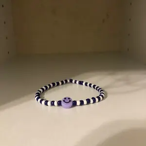 Purple smiley bracelet