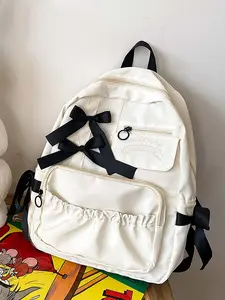 Simple design cream white bow decoration backpack, sweet campus  backpack, black three-dimensional bow decoration, exquisite fashion and versatile, suitable for students to go to class and commute, etc.
